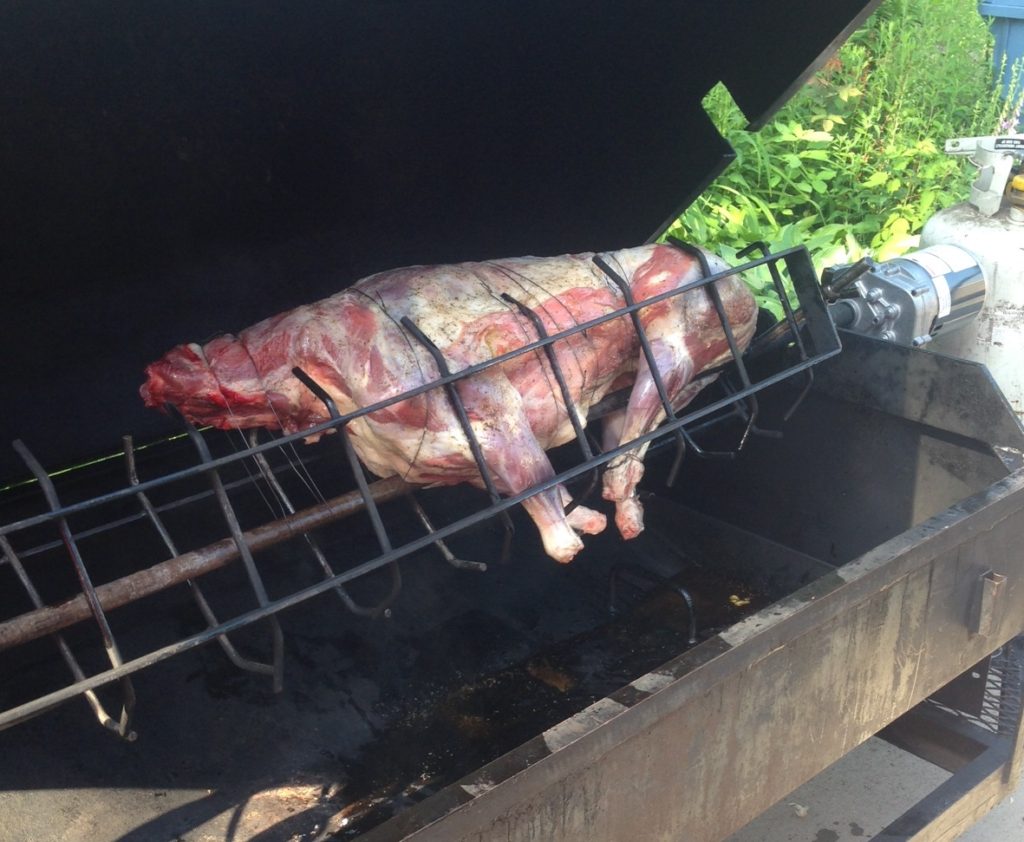 Grilling whole goat