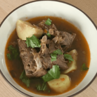 Nigerian style goat soup presented compr
