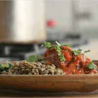 Ethiopian lamb neck served with lentils and injera.