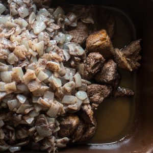 Lamb or goat mousakahn with sumac and onions