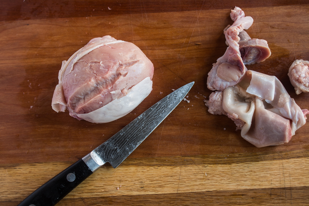 Slicing open a lamb fry to reveal the inner meat.