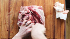 Cutting a lamb leg into roasts