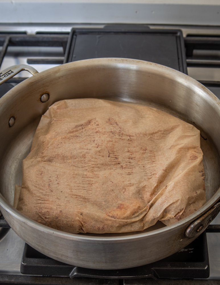 Cooking lamb breast wrapped in parchment