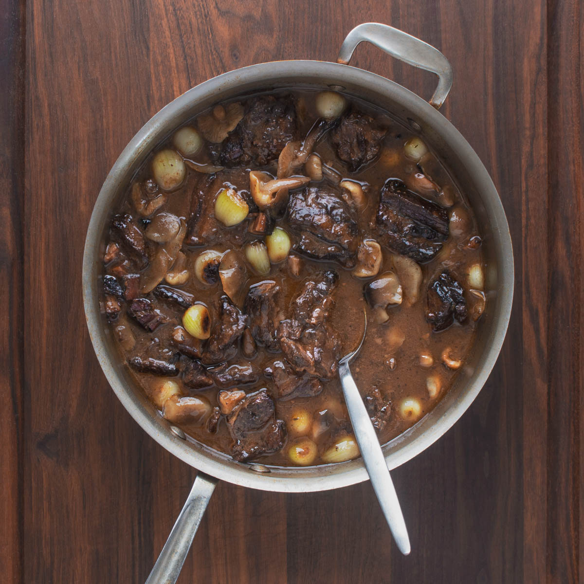 goat neck stew with red wine in a pot