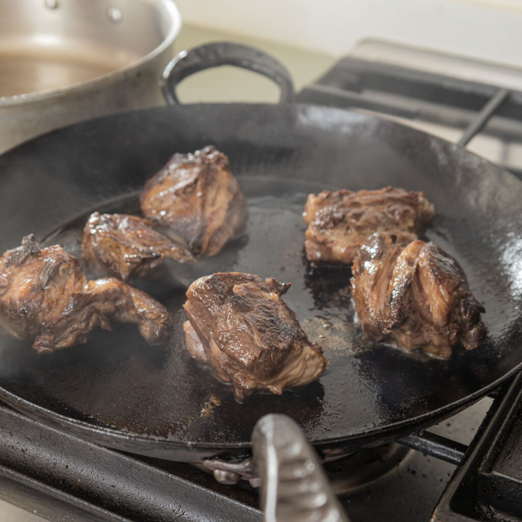 browning goat neck pieces in a pan
