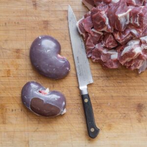 cutting lamb meat and kidneys