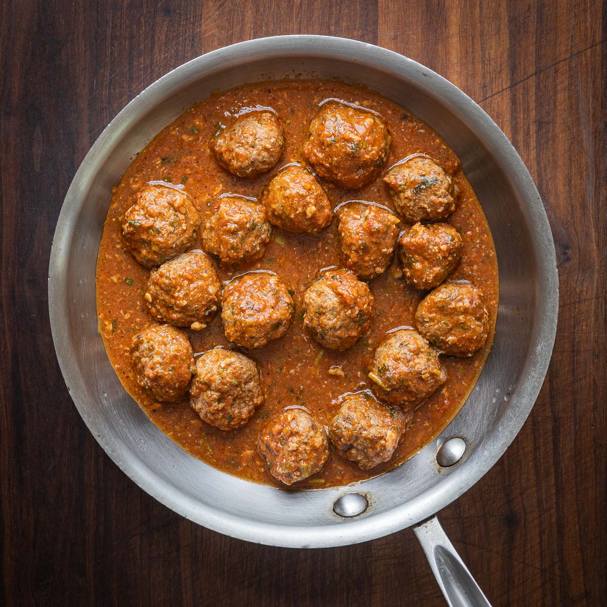 Spicy lamb meatballs cooked in a pan. 