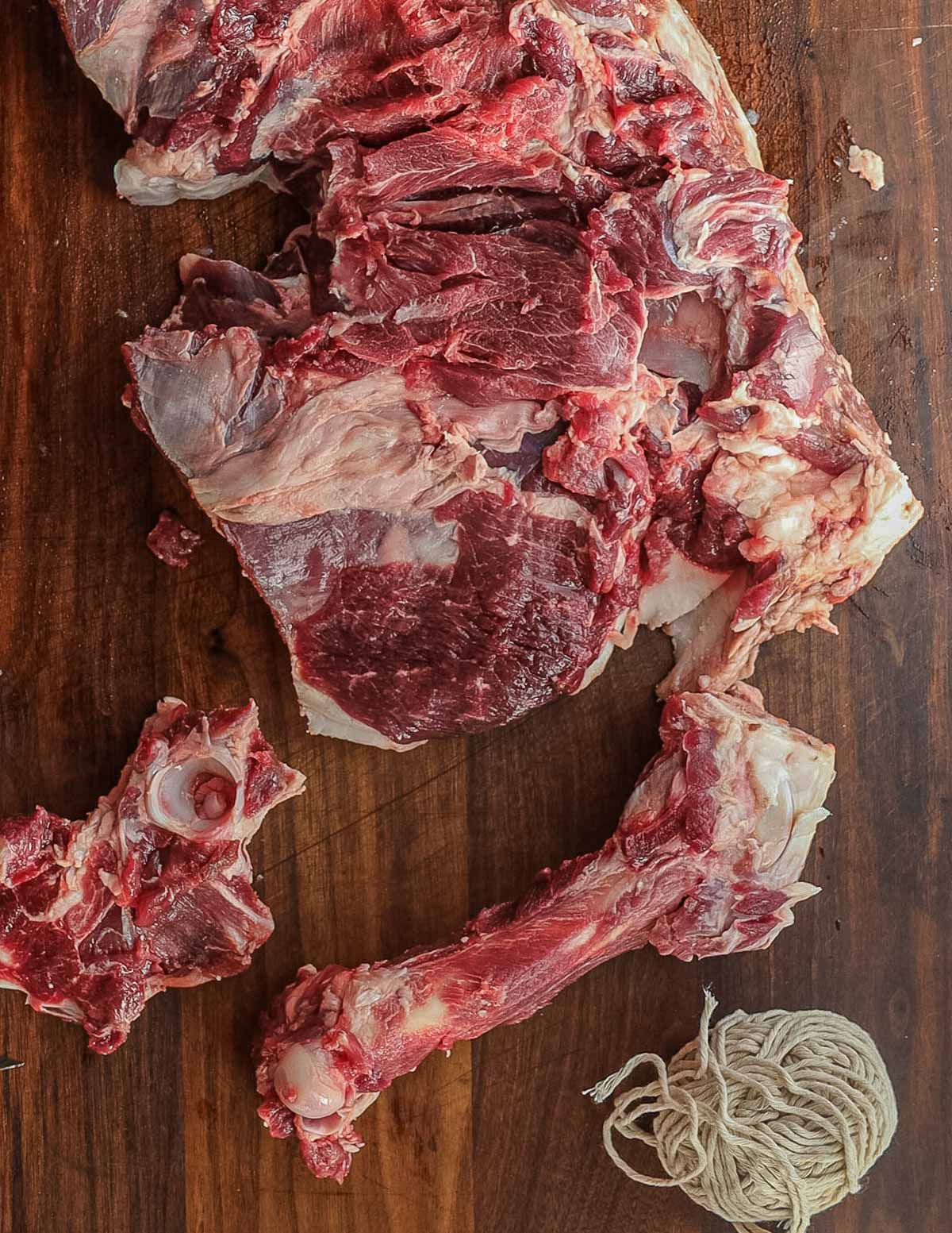 A leg of lamb cut open with the bones removed.